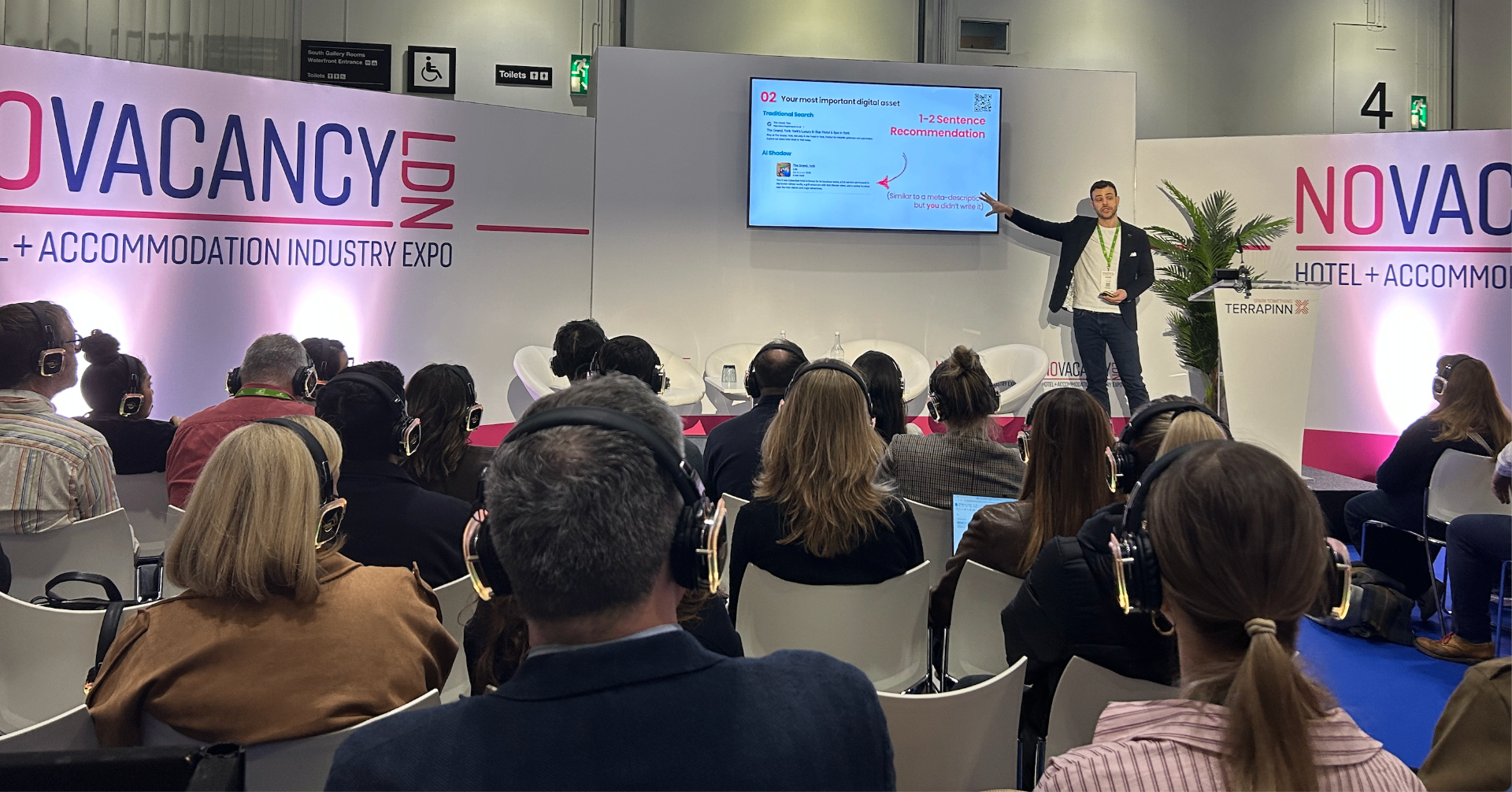 Adam Hamadache delivering a keynote to a packed audience